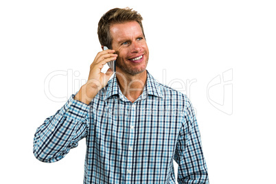 Smiling man talking on smartphone