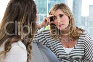 Worried mother talking to daughter