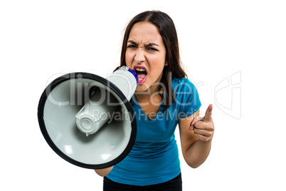 Shouting woman while holding megaphone