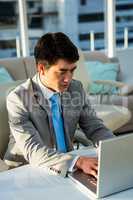 Asian businessman using his computer
