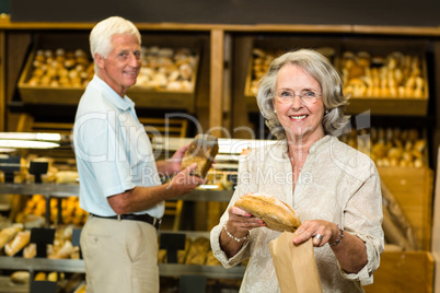 Senior couple buying bread