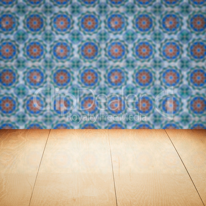 Wood table top and blur vintage ceramic tile pattern wall