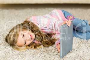 Happy girl lying on the floor