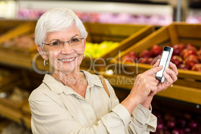 Old woman using her smartphone