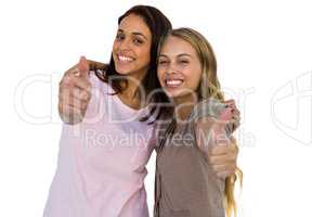 Two girls thumbs up