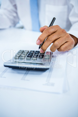 Businessman using a calculator