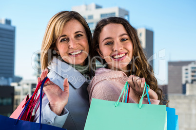 Mother and daughter smiling