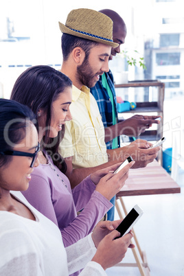 High angle view of business colleagues using phone