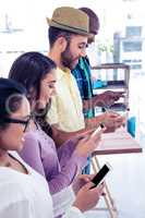 High angle view of business colleagues using phone