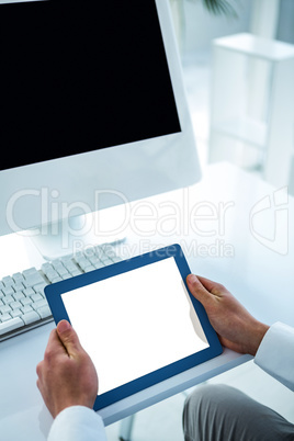 Businessman using his tablet