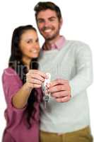 Happy couple holding keys