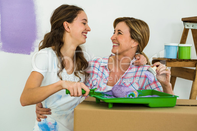 Mother and daughter preparing the paint