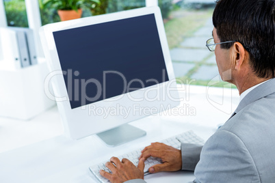 Businessman using his computer