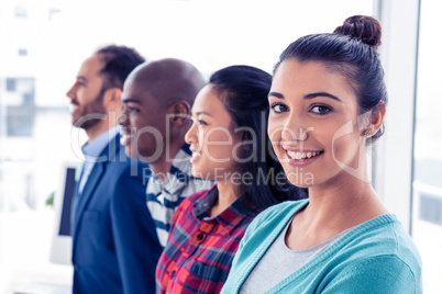 Portrait of attractive businesswoman with colleagues