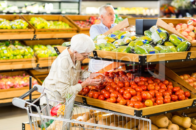 Senior couple buying food at the grocery