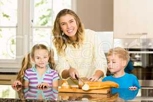 Happy family slicing bread