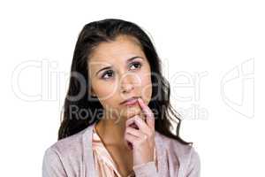 Thoughtful woman with finger on mouth