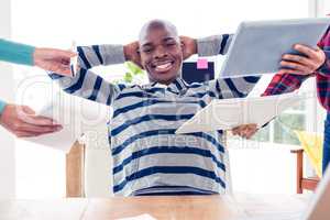 Portrait of businessman relaxing in office