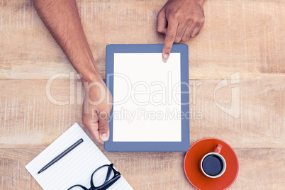 Overhead view of person holding on digital tablet