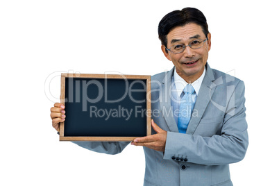 Asian businessman showing black board