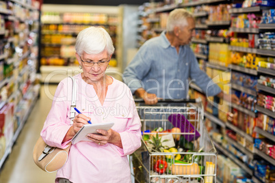 Senior woman with shopping list