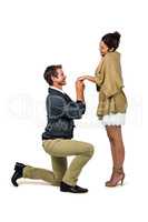 Handsome man proposing beautiful woman while kneeling