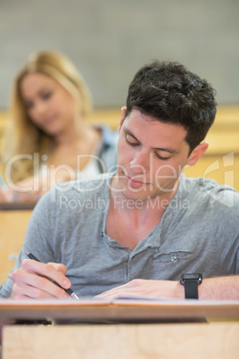 Serious male student during class