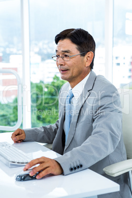 Asian businessman using his computer