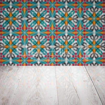 Wood table top and blur vintage ceramic tile pattern wall