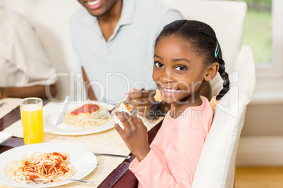 Happy family enjoying their meal