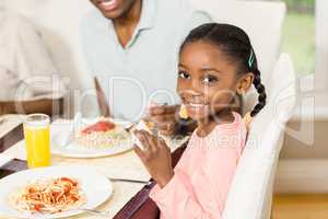 Happy family enjoying their meal