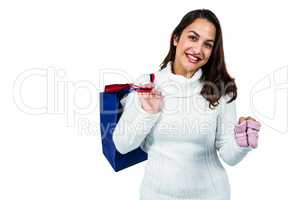 Portrait of happy young woman with shopping bags and footwear