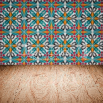 Wood table top and blur vintage ceramic tile pattern wall