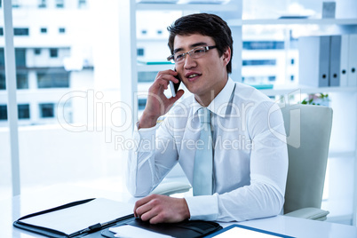 Asian businessman talking on the telephone