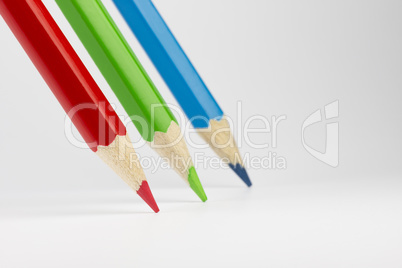 Three colored pencils in RGB colors.