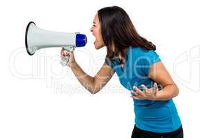 Woman shouting while holding megaphone