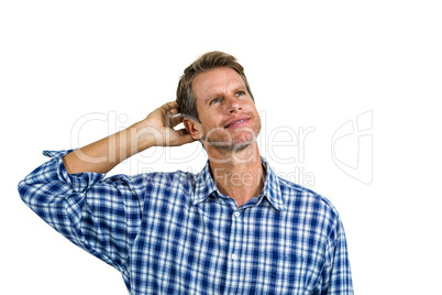 Thinking businessman scratching his head