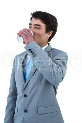 Asian businessman drinking coffee