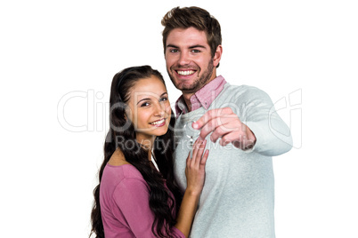 Happy couple holding keys