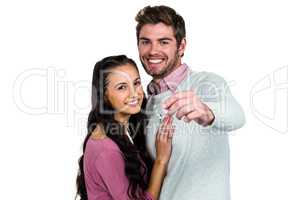 Happy couple holding keys