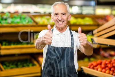 Senior worker showing thumbs ups