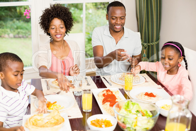 Happy family eating together