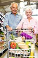 Happy senior couple shopping together
