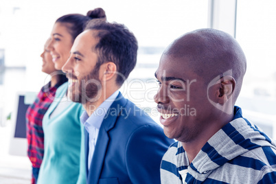 Happy business people standing in row