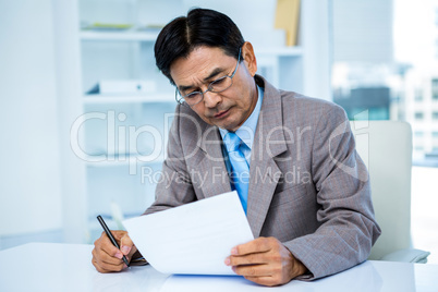 Businessman looking at document