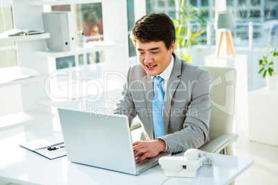 Asian businessman using his computer