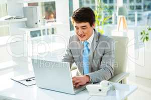 Asian businessman using his computer