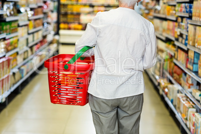 Rear view of senior woman with basket