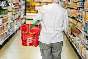 Rear view of senior woman with basket