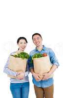 Couple holding grocery bags
